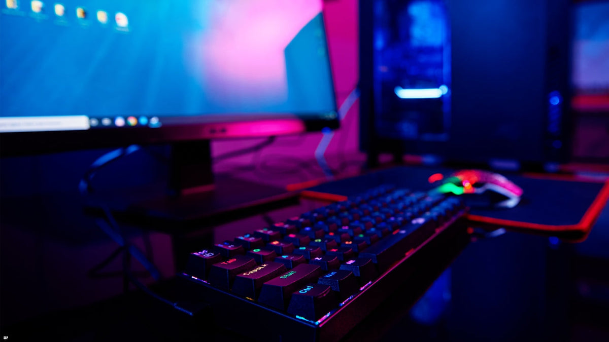 Desktop computer setup with colorful screen and keyboard