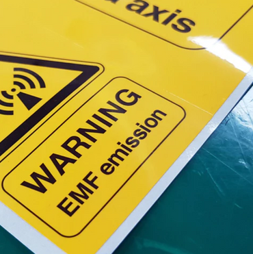 Yellow warning sign reading EMF emission