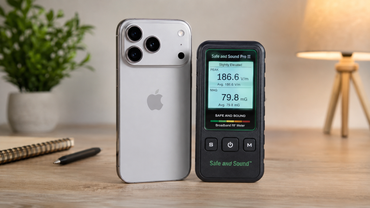 iPhone 17 Pro Max next to an EMF meter during real-world electromagnetic field testing