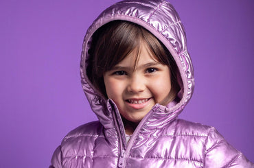 Child in a purple rain jacket