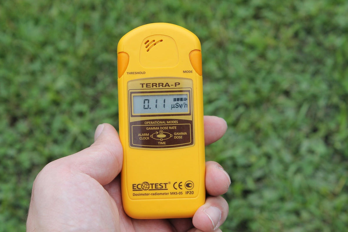 Handheld EMF meter measuring outdoors