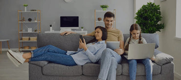 Family seated together in a living room