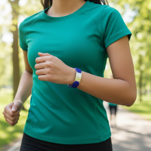 Woman wearing blue EMF protection bracelet BodyBand Plus while exercising