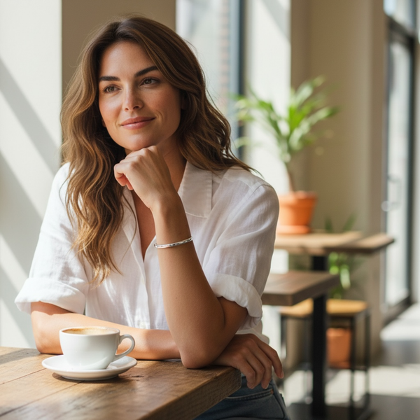 Woman wearing feminine stainless steel EMF protection cuff bracelet