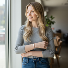 Woman wearing feminine stainless steel EMF protection bracelet cuff style