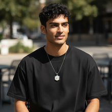 Man wearing stainless steel EMF protection necklace octagon pendant