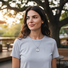 Woman wearing stainless steel EMF protection necklace octagon pendant lifestyle