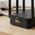 EMF Mega Shield for Routers- Gold on Black: black round sticker on white router