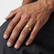 Man wearing the Safe Connect Plus gold wearable EMF Protection Ring on his hand.
