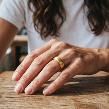 Woman wearing the Safe Connect Plus gold EMF Protection Ring during everyday use.