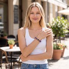 Woman wearing the Amethyst EMF Protection Beaded Bracelet outdoors