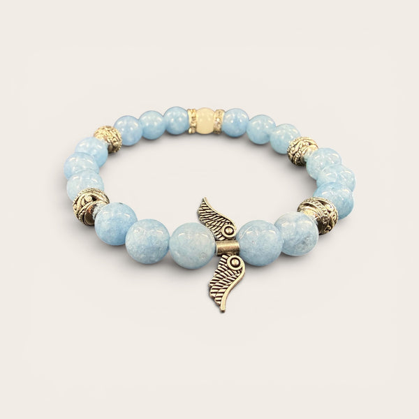 Angel Wings EMF Protection Bracelet in Sky Blue featuring light blue beaded jewelry with decorative angel wing charm