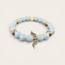 Angel Wings EMF Protection Bracelet in Sky Blue featuring light blue beaded jewelry with decorative angel wing charm