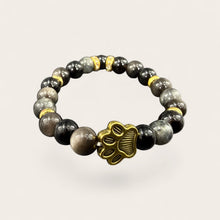 Black EMF protection bracelet with gold dog paw charm featuring 240+ resonant frequencies for everyday wellness and pet lovers