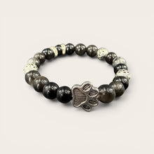 Black EMF Protection Dog Paw Bracelet featuring a silver dog paw charm, premium black beads, and proprietary 240+ resonant frequency technology.
