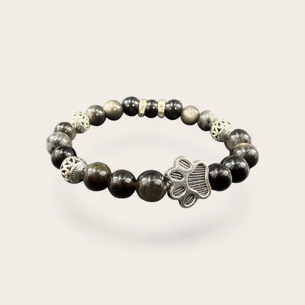 Black EMF Protection Dog Paw Bracelet featuring a silver dog paw charm, premium black beads, and proprietary 240+ resonant frequency technology.