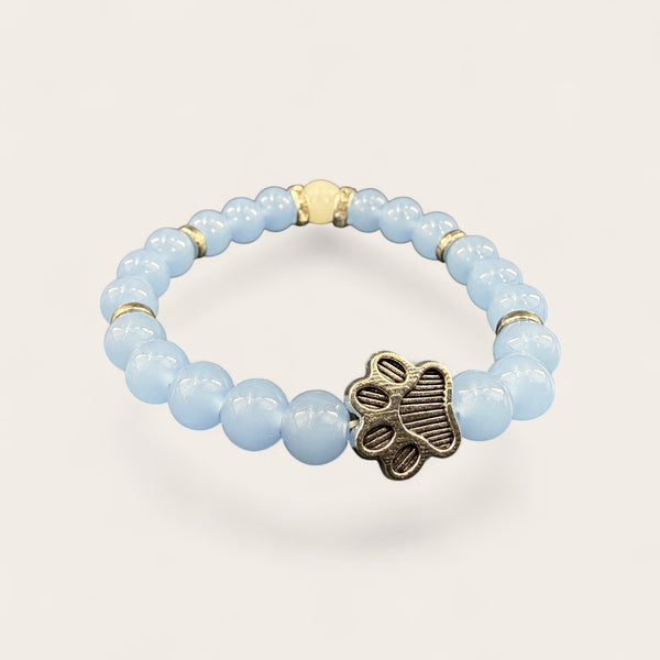 Blue EMF protection bracelet with silver dog paw charm featuring 240 plus resonant frequencies for everyday wellness and pet lovers