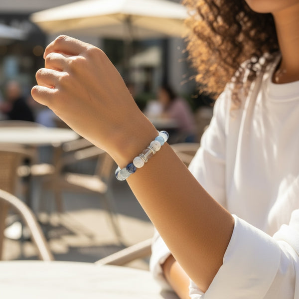 Woman wearing Blue Horizon EMF Protection Beaded Bracelet with soft blue stones for everyday EMF shielding