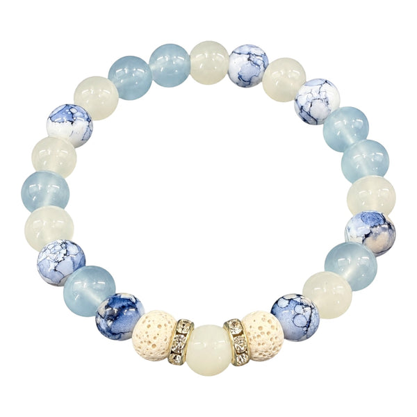 Blue Horizon EMF protection beaded bracelet with light blue, white and marbled blue beads, white lava stones and gold crystal spacers on white background
