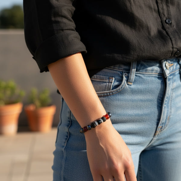 Crimson Core EMF Protection Beaded Bracelet worn on wrist with red and black stone beads for everyday EMF shielding