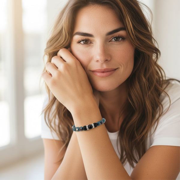 Woman wearing Earthbound EMF Protection Beaded Bracelet with natural stones and grounding design