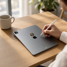 EMF Mega Shield for Tablets - Gold Cross on the back of an iPad on a home office desk