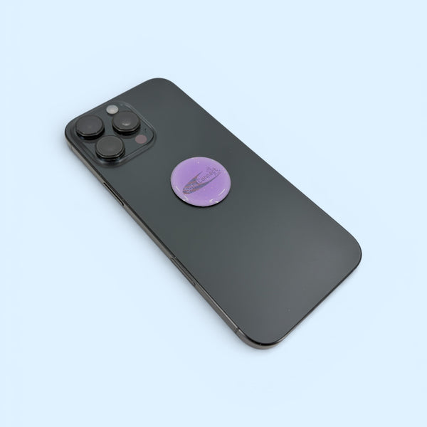 EMF Protection Mega Shield Glitz Cruzin Power Purple attached to smartphone for everyday EMF protection