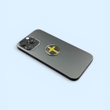 Gold Cross EMF Protection Mega Shield applied to smartphone for device EMF protection