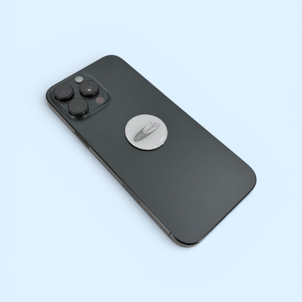 EMF Protection Mega Shield Silver on White attached to smartphone for EMF and radiation protection