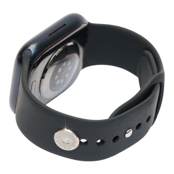 EMF Protection Smart Watch Clip Button Shield on a black smartwatch band - round silver Safe Connect Plus button clipped to the band