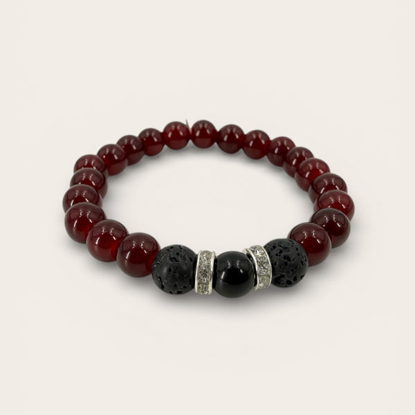 Garnet EMF protection beaded bracelet with lava stones and harmonizing EMF protection bead on a clean white background