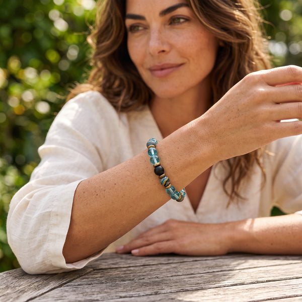 Woman wearing the Lake Blue EMF Protection Beaded Bracelet outdoors