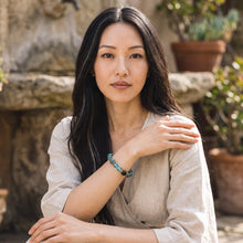 Woman wearing the Lake Blue EMF Protection Beaded Bracelet