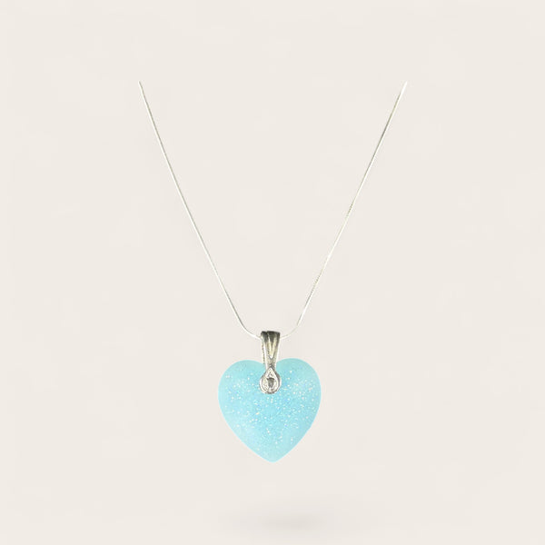 Neon Blue Heart EMF Protection Necklace featuring a sparkling blue heart pendant and stainless steel chain for wearable EMF protection.