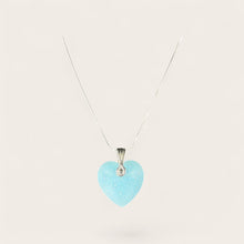 Neon Blue Heart EMF Protection Necklace featuring a sparkling blue heart pendant and stainless steel chain for wearable EMF protection.