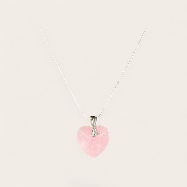 Neon Pink Heart EMF Protection Necklace featuring a sparkling heart pendant and stainless steel chain for everyday wearable protection.