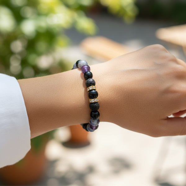 Close-up of Nightfall EMF Protection Beaded Bracelet highlighting black lava stones, purple gemstones, and crystal spacer details