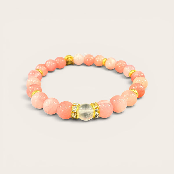 Pink Cat Lover EMF Protection Bracelet featuring pink beaded stones, gold accents, and wearable EMF protection technology.