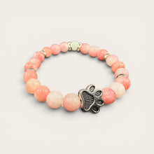 Pink EMF protection bracelet with silver dog paw charm featuring 240+ resonant frequencies for everyday EMF protection.