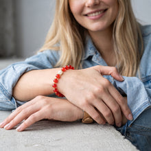 Woman wearing the Red Auspicious EMF Protection Beaded Bracelet with a denim jacket