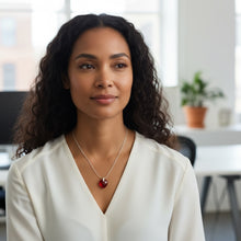 EMF Protection Necklace Red Heart worn by a woman