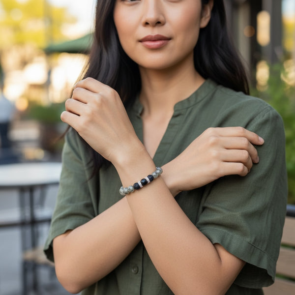 Woman wearing Stoneveil EMF Protection Beaded Bracelet designed for daily EMF protection and style