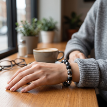 Ultimate EMF Protection Beaded Bracelet worn during everyday activities with premium matte black and metallic beads and proprietary resonant frequency technology.