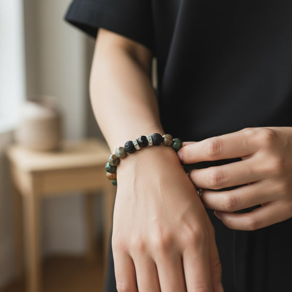 Wildstone EMF protection bracelet worn on wrist featuring natural green and earth-tone stone beads