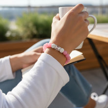 Women’s pink EMF protection beaded bracelet supporting daily EMF exposure